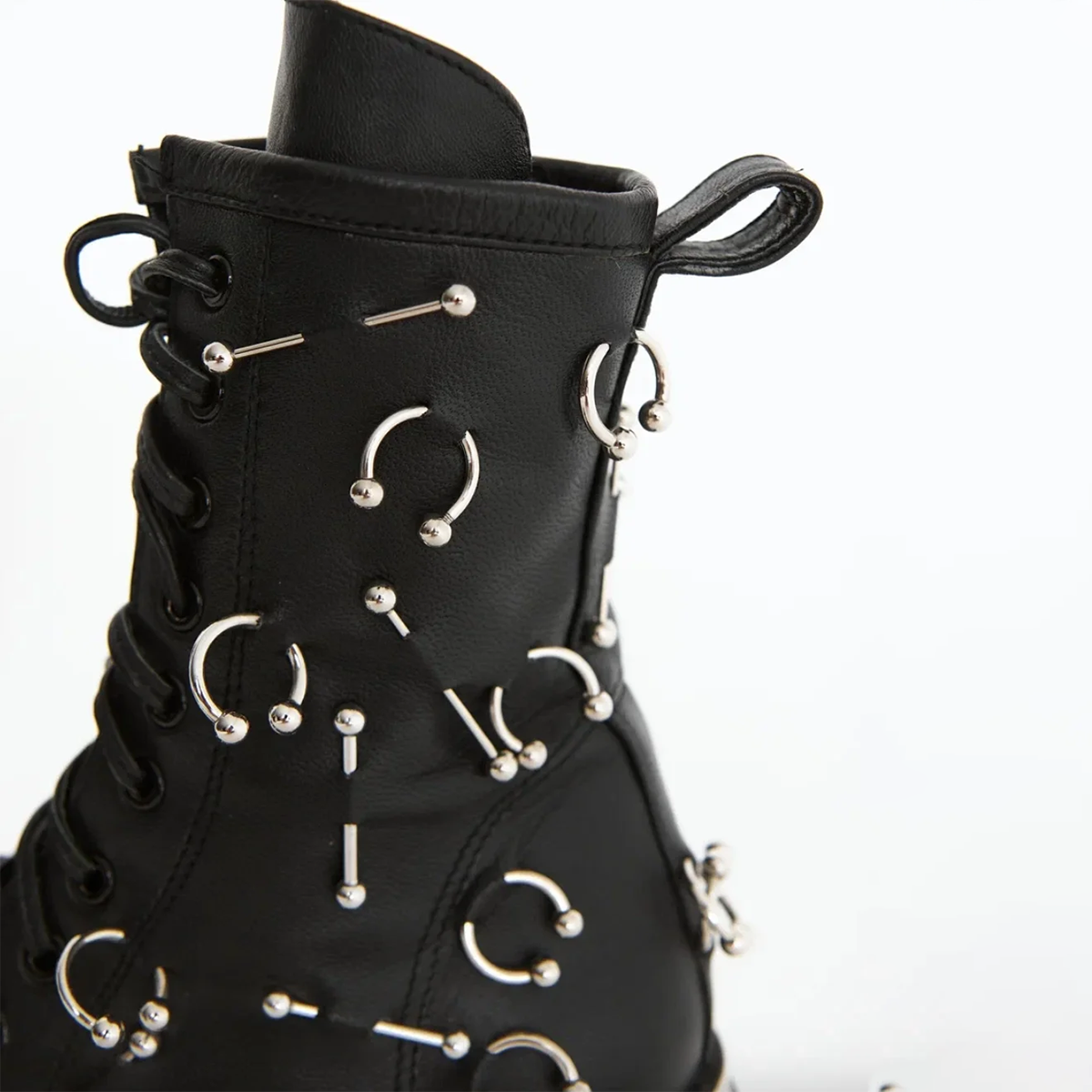 Boots with piercing decoration in a daring style