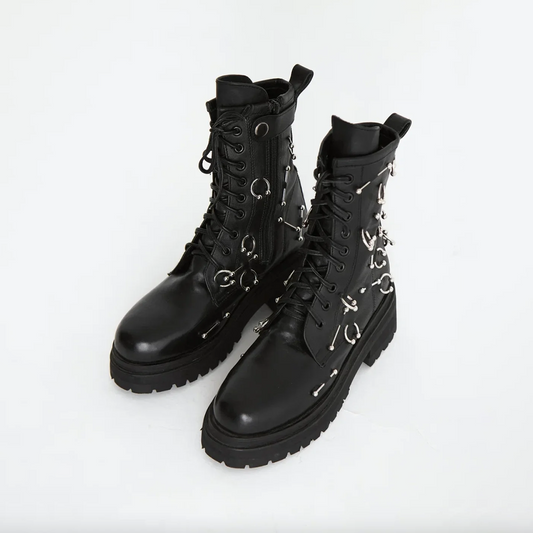 Boots with piercing decoration in a daring style