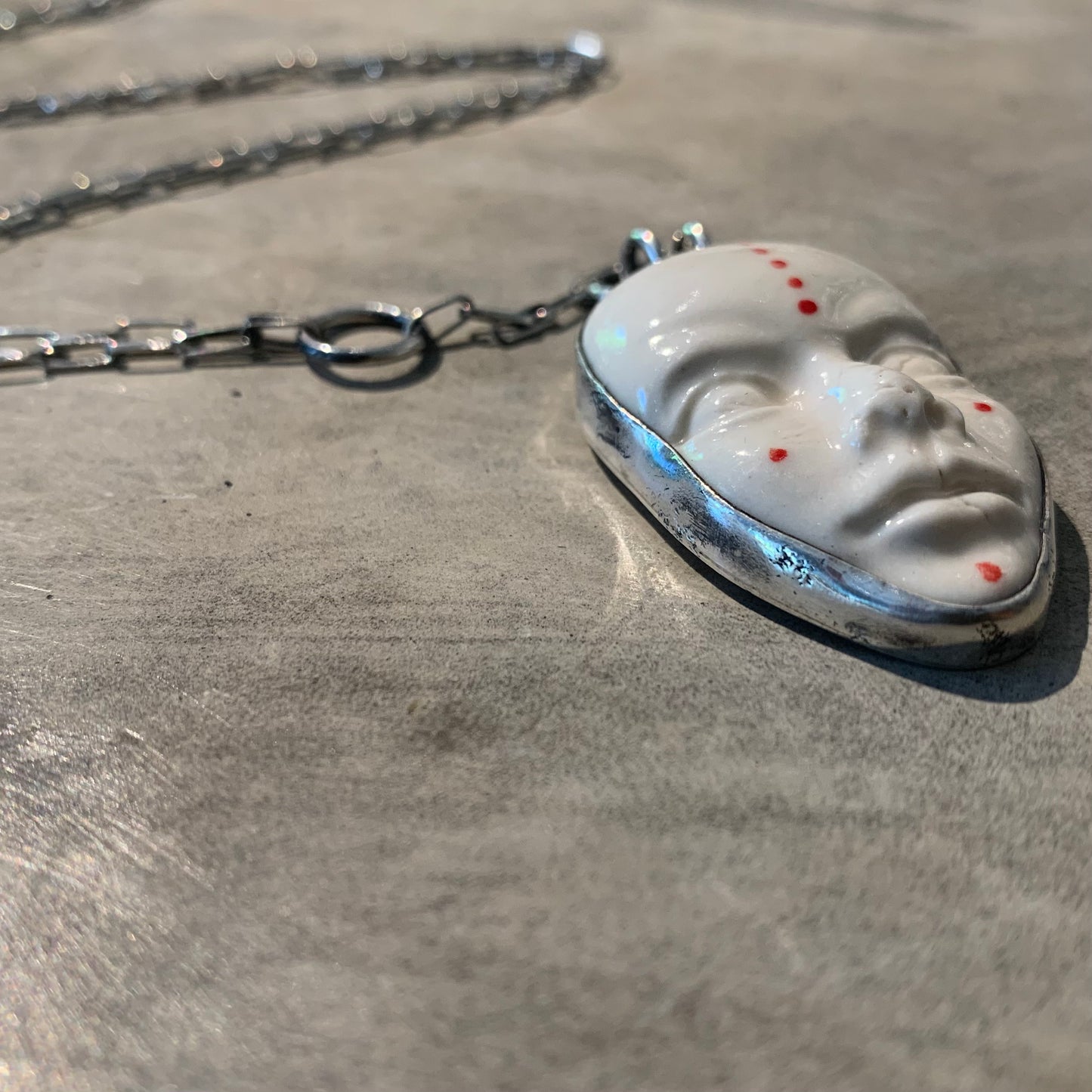 Pride face necklace (silver)