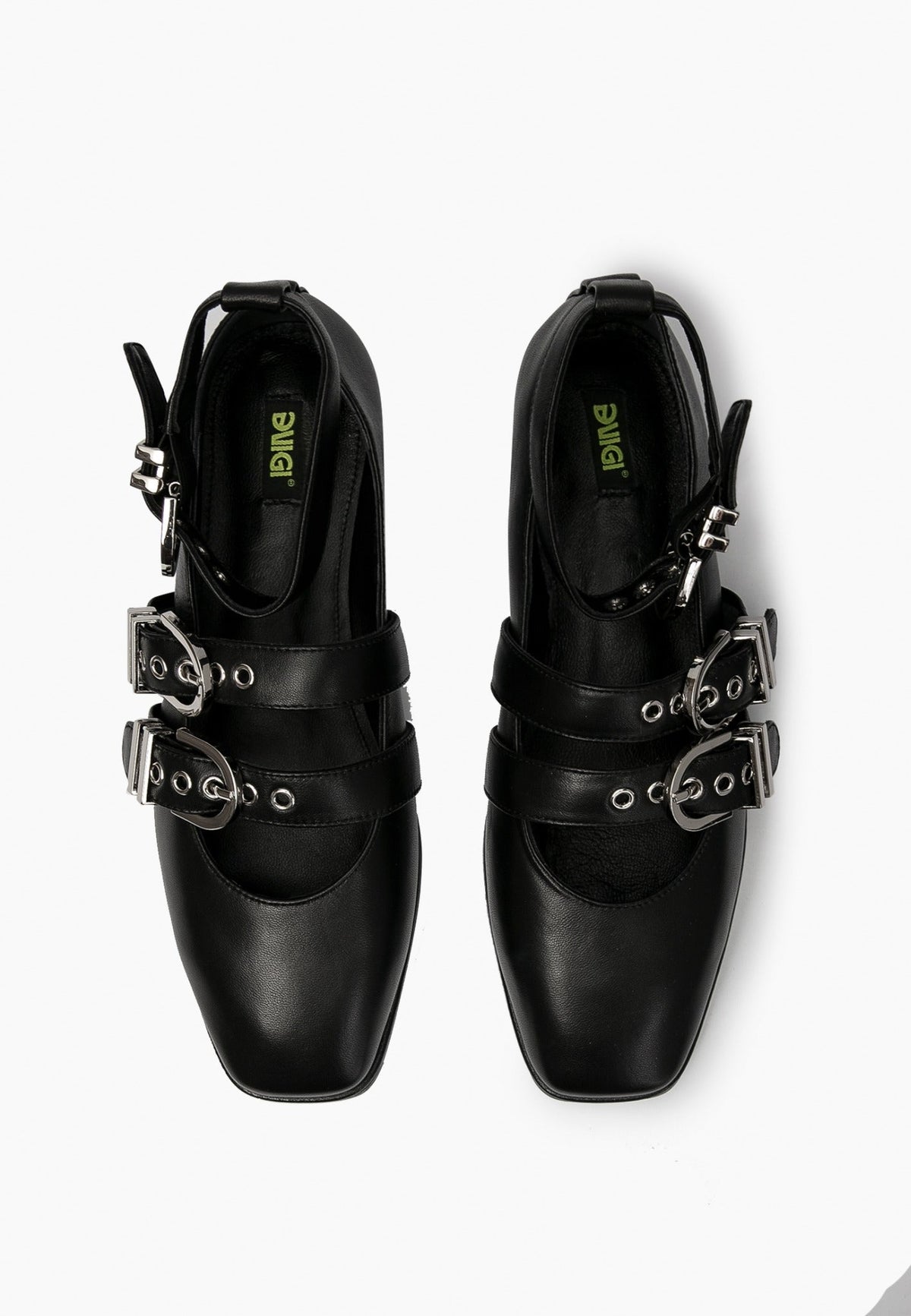 Top view of black leather ballet flats with two instep straps and ankle buckles