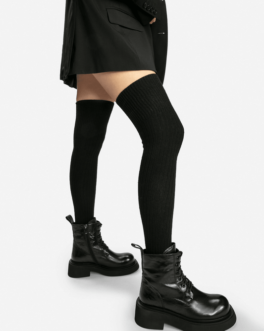 Black vintage leather boots styled on model