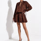 Dark chocolate suede mules styled with a tonal mini dress