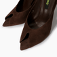 Close-up of dark chocolate elongated peep-toe mule