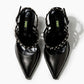 Top view of black leather pointed heels with crystal-set straps