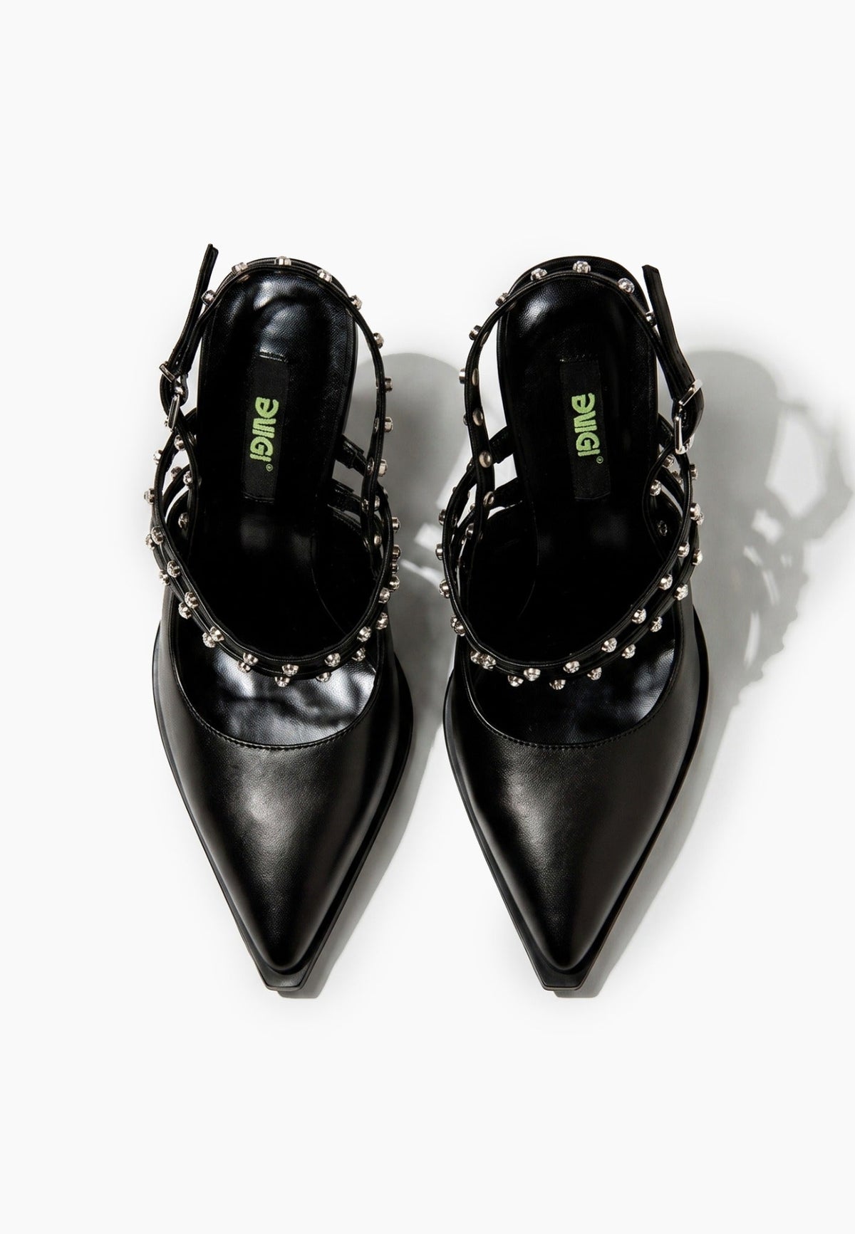 Top view of black leather pointed heels with crystal-set straps