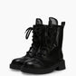 Pair of black lace-up mesh combat boots with leather toe caps and chunky soles
