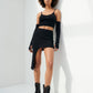 Black mesh combat boots styled on a model in a monochrome outfit