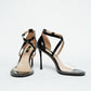 Front and side views of black patent stiletto heels with silver trim