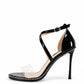 Black patent leather heels with clear toe strap and silver stud trim, side view