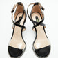 Top view of black patent heels with transparent front straps