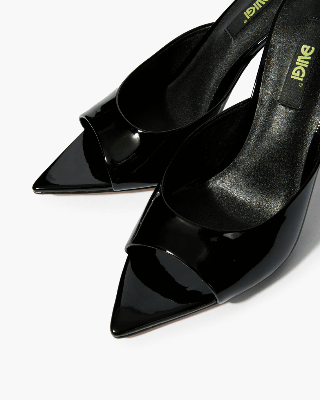 Black patent leather mules with open toe and pointed footbed detail