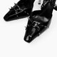 Black patent leather heels — square toe, spike and heart-shaped ring details