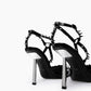 Black spiked heels — silver-tone sculptural heels and rear strap detail