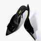Black patent leather stiletto mules, top view