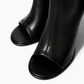 Black leather ankle boots with open toe and tonal stitching