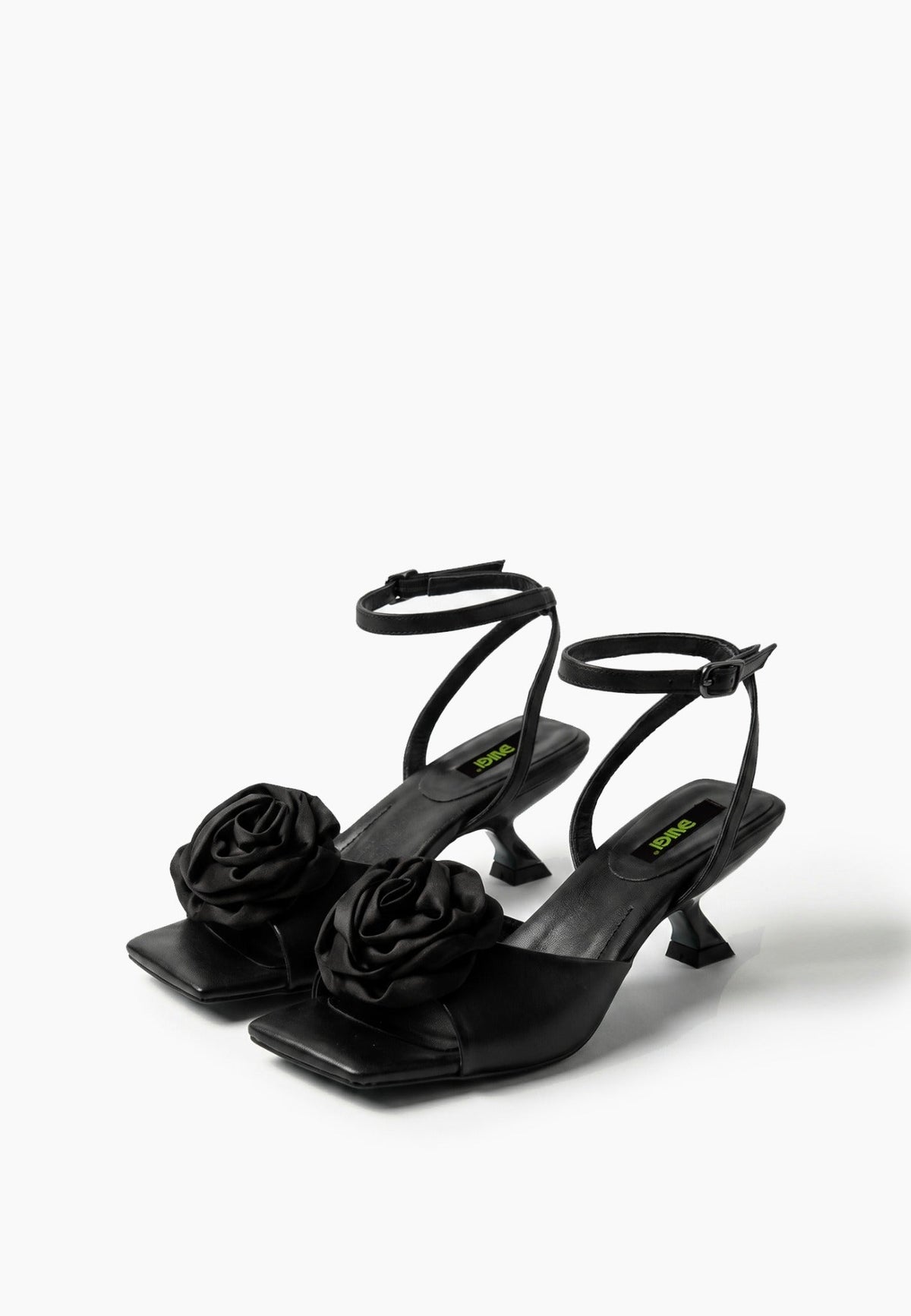 Black leather low-heel sandals with textile rosettes, pair view