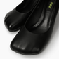 Black square-toe pumps — toe shape and upper detail