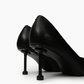 Black pumps — sculptural slim heel detail