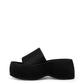 Black structured textile platform slide with a wide single band, side profile