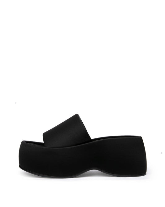 Black structured textile platform slide with a wide single band, side profile