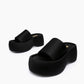 Black textile platform slides arranged at different angles on a white background