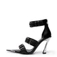 Black leather triple-buckle heels with chrome-coated pointed toe and sculptural high heel, side view