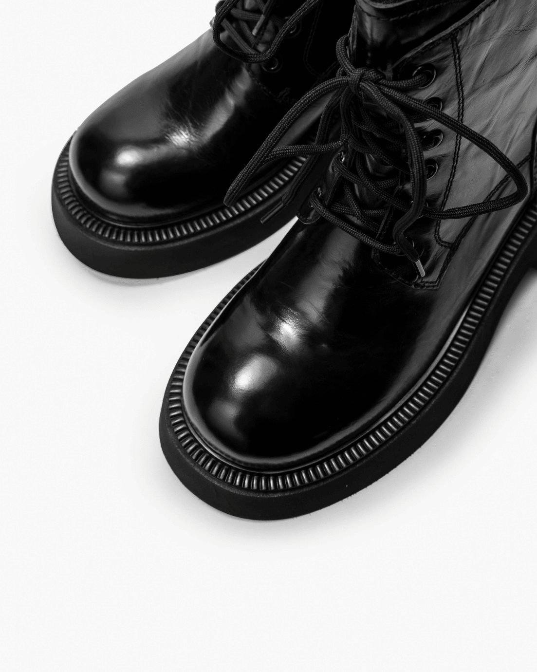 Black vintage leather boots with rounded toe and welt detail