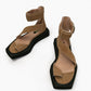 Top view of camel suede sandals with crossover straps and toe loops