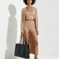 Camel suede platform sandals styled with a neutral outfit and black tote