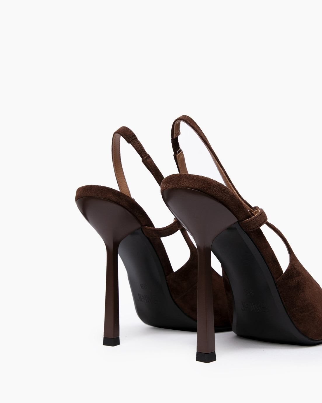 Rear view of brown suede slingback heels showing narrow straps and slim stilettos