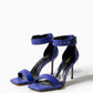 Pair of cobalt blue genuine leather heels with black buckles