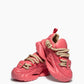 Pair of coral pink chunky sneakers showing rope laces and sculpted soles