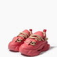 Front three-quarter view of coral pink rope-lace platform sneakers