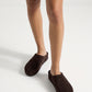Dark chocolate suede slip-on clogs worn in studio
