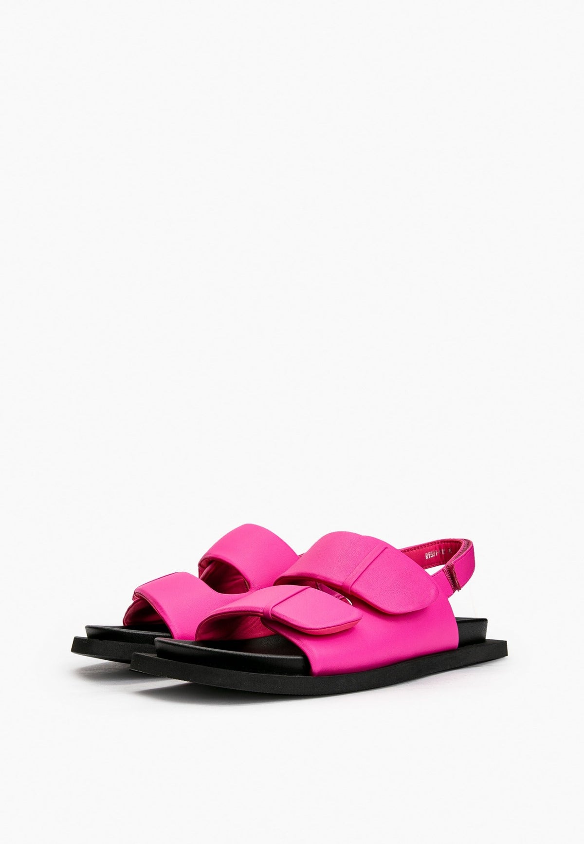 Pair of fuchsia pink leather comfort sandals with black flat soles
