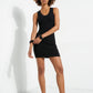Full model styling indigo denim buckle ballet flats with a fitted black mini dress