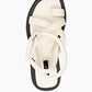 Top view of ivory leather flatform sandals with padded straps and adjustable closure