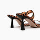 Leopard-print heels with black sculptural heel, rear view