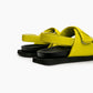 Rear view of lime green leather sandals with adjustable heel straps