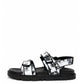 Black and white printed leather sandals with adjustable straps and lug sole, side profile