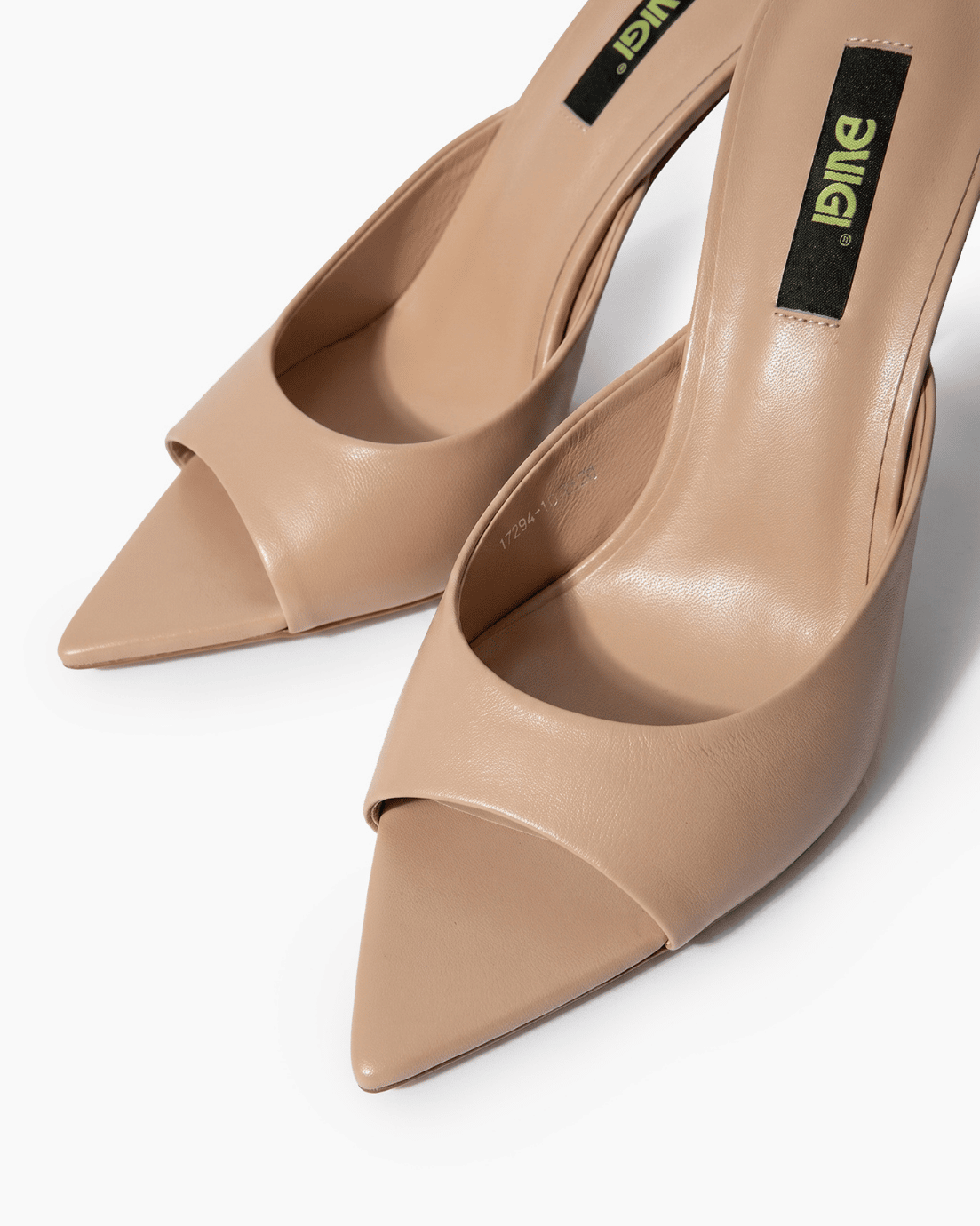 Nude beige leather mules with open toe and extended pointed sole detail