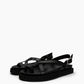 Pair of black leather toe-loop sandals with slim crossover straps