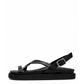 Black genuine leather toe-loop sandals with crossed straps and platform sole, side view