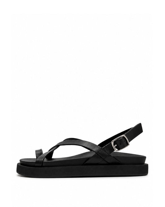 Black genuine leather toe-loop sandals with crossed straps and platform sole, side view