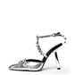 Silver metallic leather heel with spiked ankle straps and an angular heel, side profile