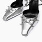 Close-up of silver leather square toes, heart-shaped rings and spike details