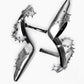 Overhead arrangement of silver leather shoes with contrasting black leather insoles
