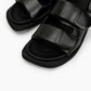 Close-up of soft black leather padded straps and cushioned footbed