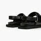 Rear detail of black leather comfort sandals with adjustable heel strap