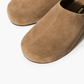 Taupe suede clogs with closed toe and centre seam detail